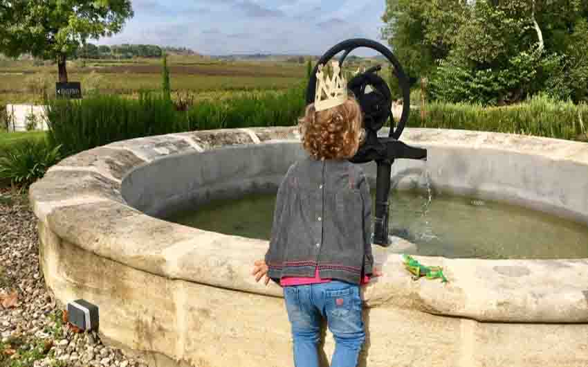 A French Chateau's Fountain with The Little Voyager