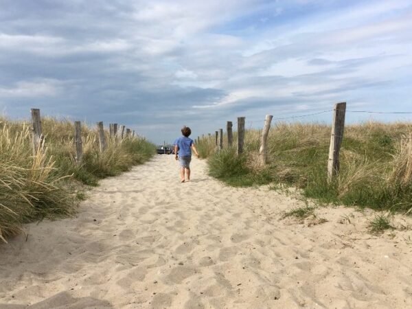 The Baltic Sea Escape boy running towards beach