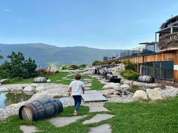 Boy walking on the grounds of the South Tyrolean Panorama Retreat