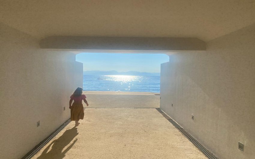 woman in tunnel to beach and sea