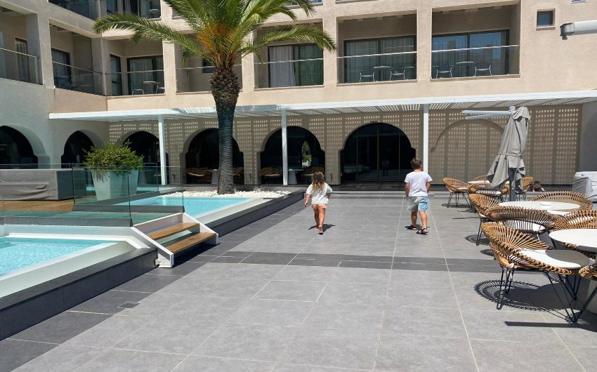 children walking next to pool