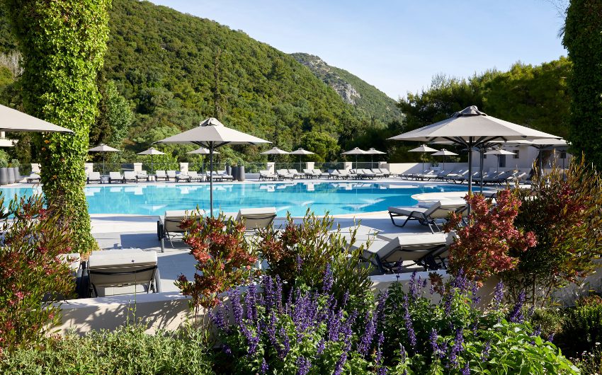 outside pool area with terrace and flowers