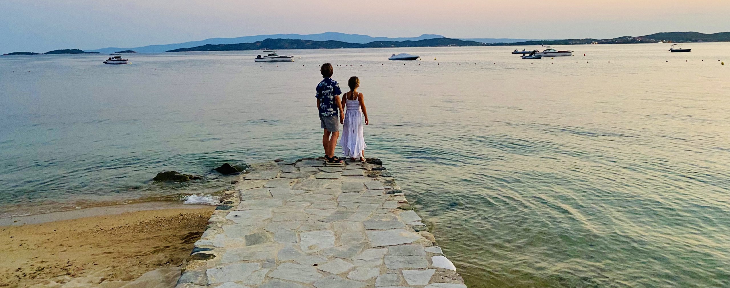 two children on path next to the sea